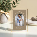 Arch Photo Beige Bow & Ribbon Wedding Table Number<br><div class="desc">Capture your love story in a modern and elegant way with our acrylic bow and ribbon wedding table number sign. Featuring a minimalistic design, with our hand drawn bow and ribbon arch design allows you to showcase your photo with grace and style. Elevate your wedding décor to new heights and...</div>