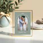 Arch Photo Green Bow & Ribbon Wedding Table Number<br><div class="desc">Capture your love story in a modern and elegant way with our acrylic bow and ribbon wedding table number sign. Featuring a minimalistic design, with our hand drawn bow and ribbon arch design allows you to showcase your photo with grace and style. Elevate your wedding décor to new heights and...</div>
