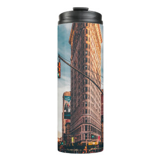 ARCHITECTURAL PHOTOGRAPHY OF BROWN BUILDING THERMAL TUMBLER