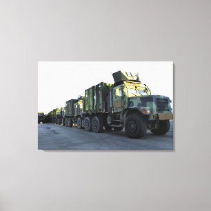 Armoured trucks sit on the pier at Morehead City Canvas Print