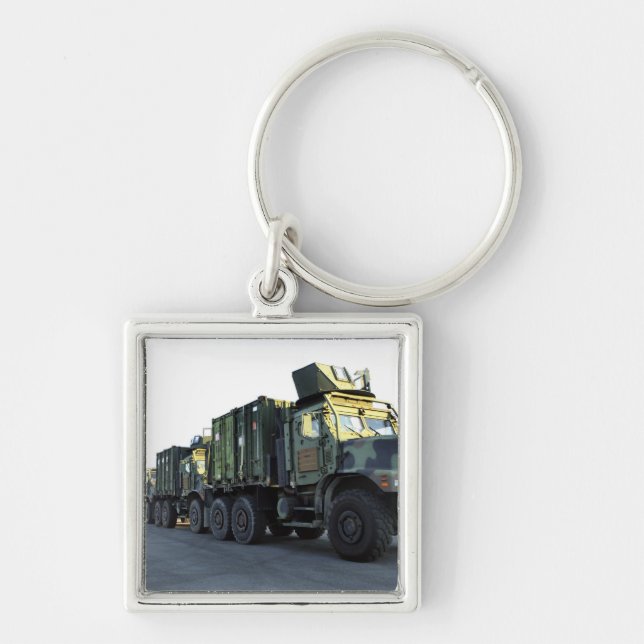 Armoured trucks sit on the pier at Morehead City Key Ring (Front)