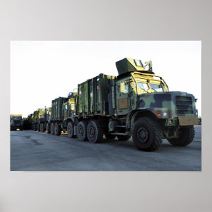 Armoured trucks sit on the pier at Morehead City Poster