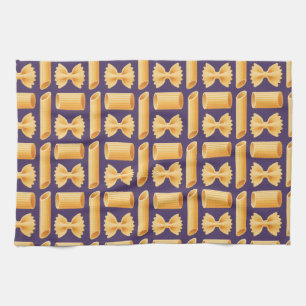 Array of various pasta shapes on a purple tea towel