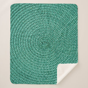 Artificial braided green fabric texture. sherpa blanket