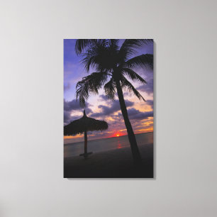 Aruba, silhouette of palm tree and palapa on canvas print