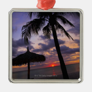 Aruba, silhouette of palm tree and palapa on metal tree decoration