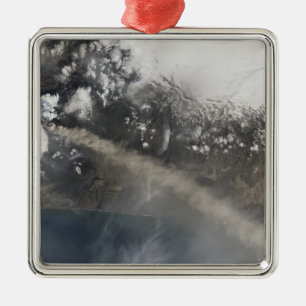 Ash and steam continue billowing metal tree decoration