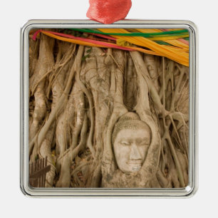 Asia, Thailand, Siam, Buddha in tree ruts at Metal Tree Decoration