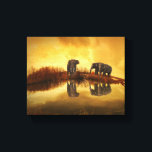 Asian Elephants in Thailand under a glowing sunset Canvas Print<br><div class="desc">Beautiful photo of a group of asian elephants taken in Thailand under the setting sun. The lighting in this photo creates a vintage retro mood.</div>