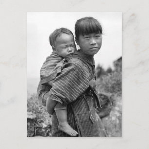 Asian girl carrying child on her back (1908) postcard