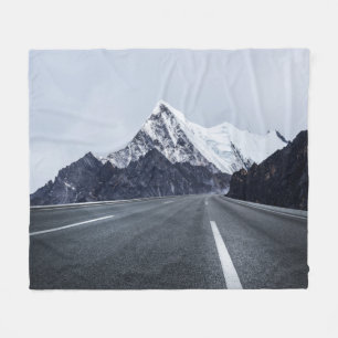 Asphalt Road in front of Snow Mountain Fleece Blanket