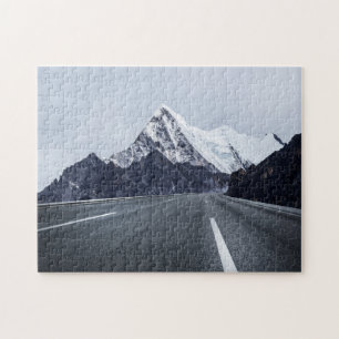 Asphalt Road in front of Snow Mountain Jigsaw Puzzle
