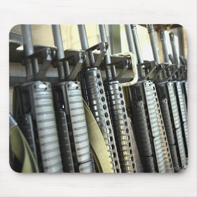 Assault rifles stand ready on the weapons rack mouse mat (Front)