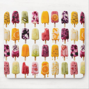 Assorted Frozen Fruit Popsicles on White Mouse Mat