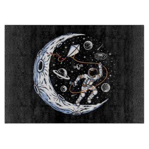 Astronaut Flying a Kite on the Moon Cutting Board
