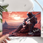 Astronaut Guitarist Playing Guitar  - Birthday Card<br><div class="desc">It was the day of his birthday, and the astronaut had decided to do something special. He had been to many planets during his time in space, but he'd never been to this one. This planet was different from any other he had seen before, with a surface that was a...</div>