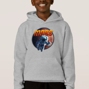 Astronaut in front of the Mars planet.