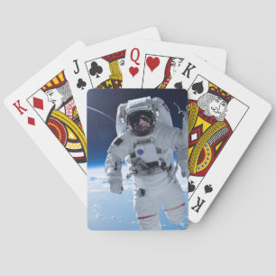 Astronaut in space playing cards
