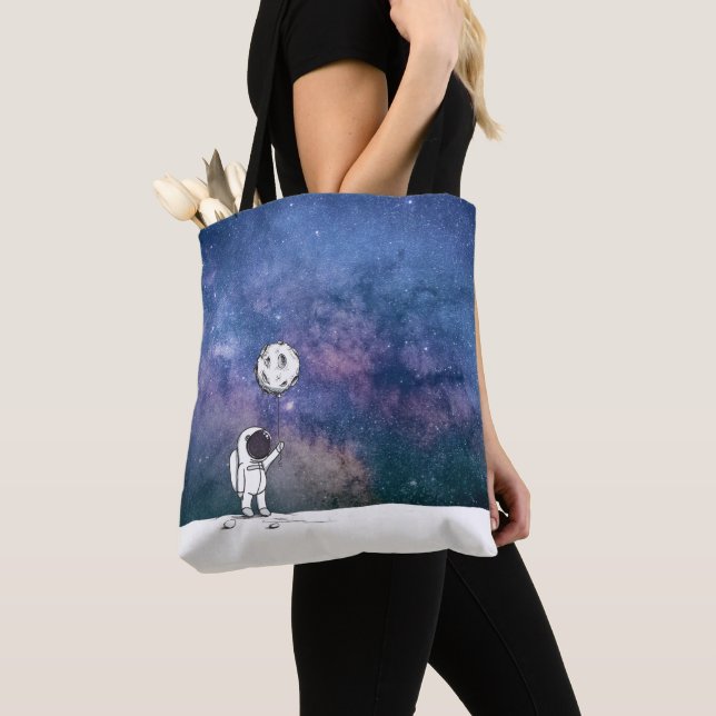Astronaut in space with moon balloon cosmos stars tote bag (Close Up)