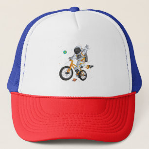 astronaut in spacesuit riding bmx bike on space ov trucker hat