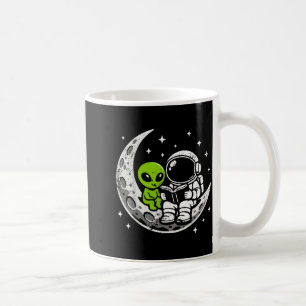 Astronaut reading book alien moon space coffee mug