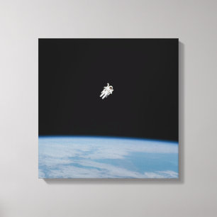 Astronaut Spacewalking Above Earth Canvas Print