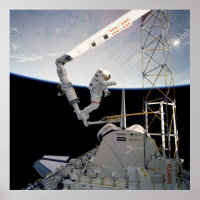 Astronaut working aboard Space Shuttle Atlantis