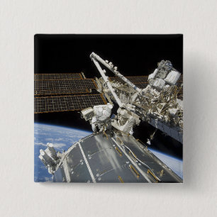 Astronauts perform a series of tasks 15 cm square badge