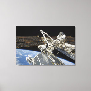 Astronauts perform a series of tasks canvas print