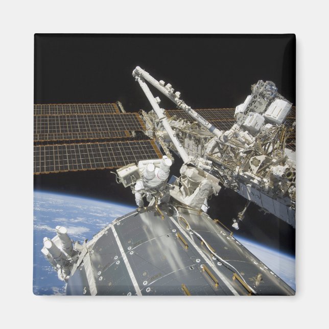 Astronauts perform a series of tasks magnet (Front)