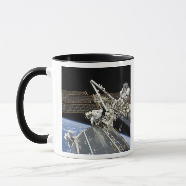 Astronauts perform a series of tasks mug (Left)