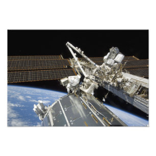 Astronauts perform a series of tasks photo print