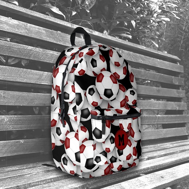 Athletes monogrammed maroon black soccer balls printed backpack (on bench)