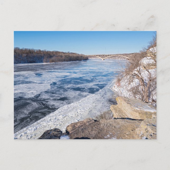 Atop cliff overlooking frozen mississippi river holiday postcard (Front)