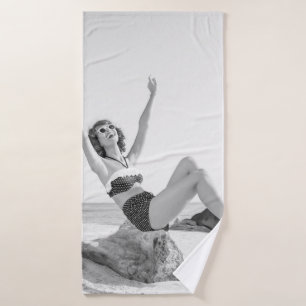 Attractive young woman in bikini on the beachvinta bath towel