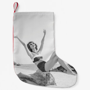 Attractive young woman in bikini on the beachvinta small christmas stocking