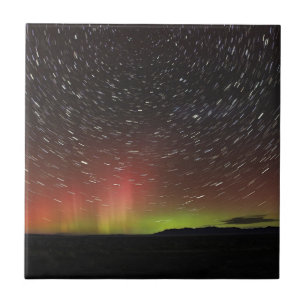 Aurora borealis on northern horizon stars overhead tile