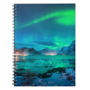 Aurora borealis over the sea coast, snowy mountain notebook