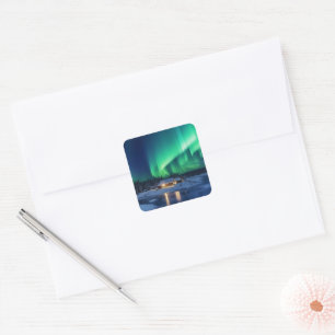 Aurora borealis over winter cabin square sticker