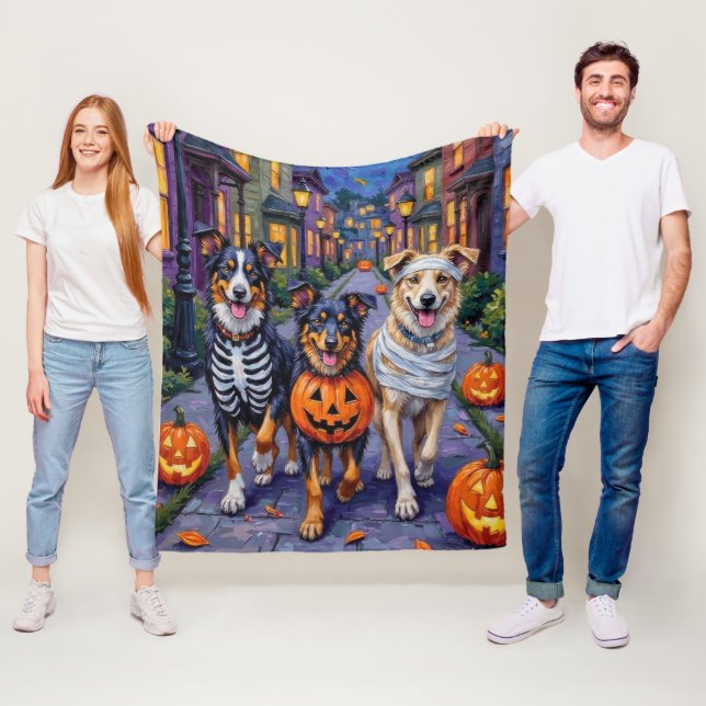 Australian Shepherd Trick-or-Treating in Halloween Fleece Blanket (In Situ)