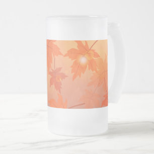 Autumn design with maple leaves and bokeh effect frosted glass beer mug