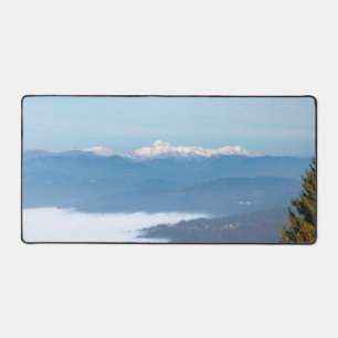 Autumn fog below mountain Triglav Desk Mat