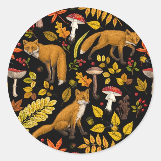 Autumn foxes on black classic round sticker (Front)