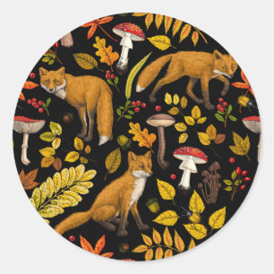 Autumn foxes on black classic round sticker
