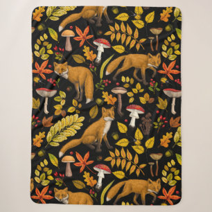 Autumn foxes on black sherpa blanket