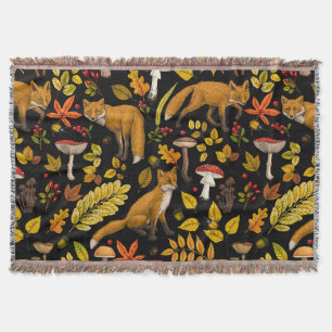 Autumn foxes on black throw blanket