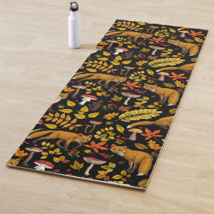 Autumn foxes on black yoga mat
