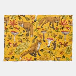 Autumn foxes on orange tea towel
