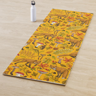 Autumn foxes on orange yoga mat