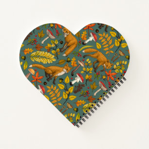 Autumn foxes on pine green notebook